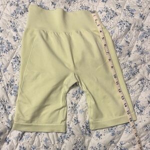 Gymshark High-Waist Athletic Biker Shorts in Pale Yellow